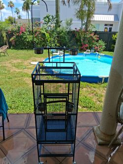 Large bird Cage with wheels excellent condition . 4 bowls included.  No toys
