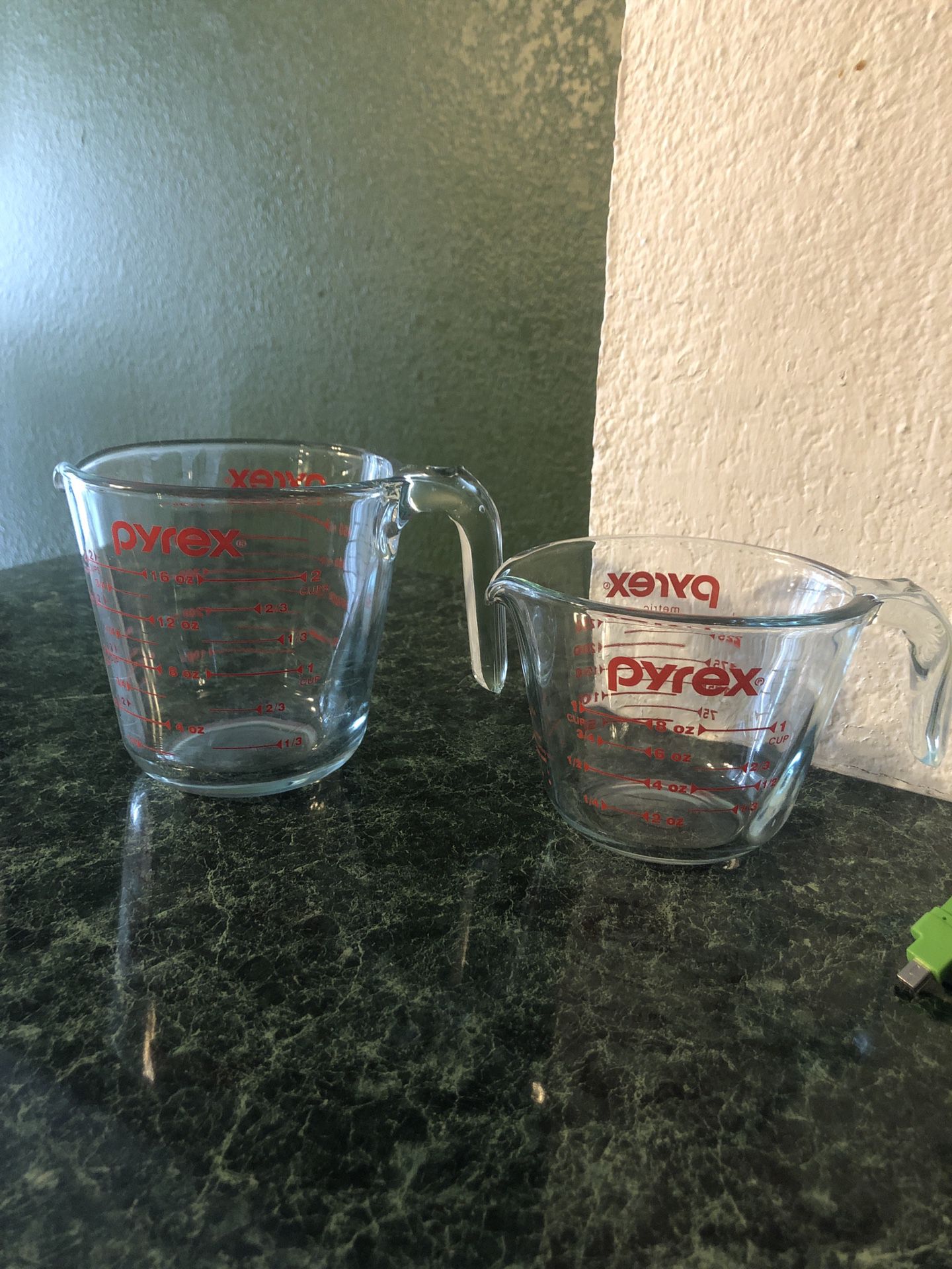 Set of Pyrex glass measuring cups, 2 cup size and 1 cup size