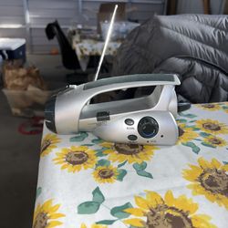 Battery-Free Wind Up Flashlight & FM Radio. No cord & the outer charge for radio doesn’t hold very long.