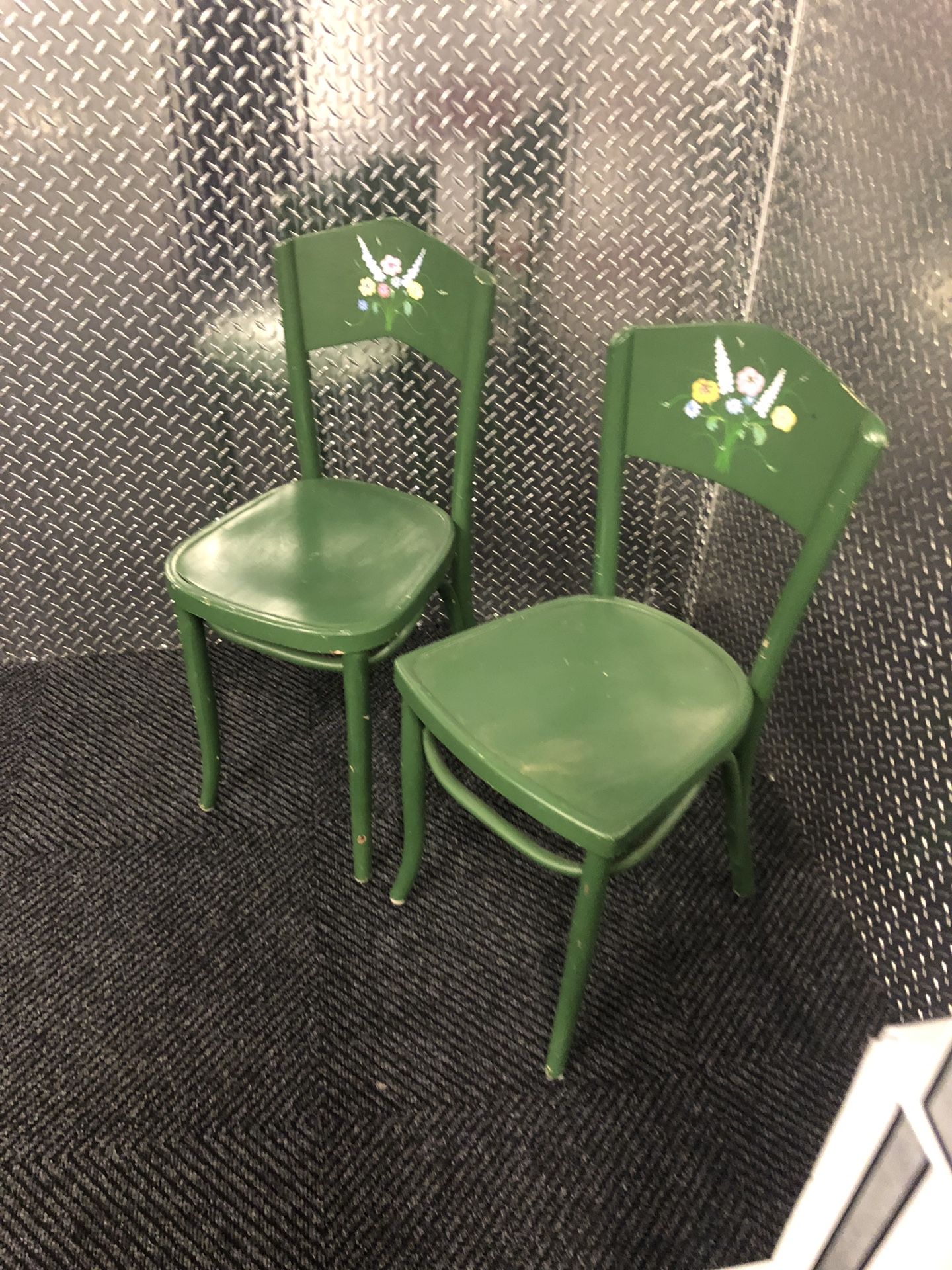 Two green antique wooden chairs