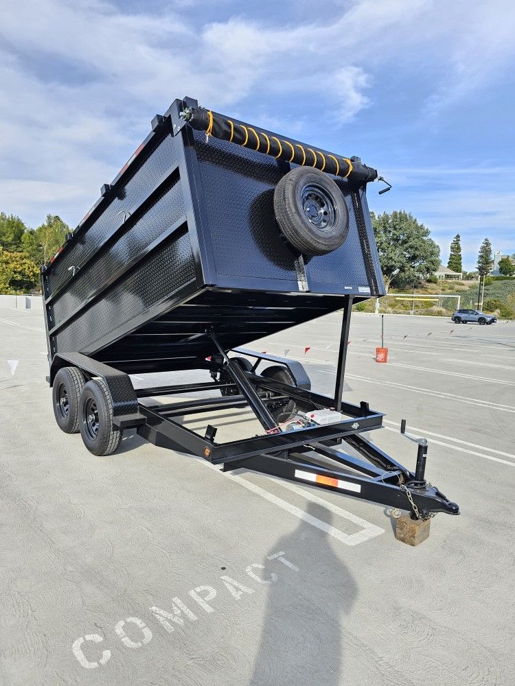 NEW DUMP TRAILER 8X12X4 12000 LBS
ROLLING TARP--SPARE TIRE,ELECTRIC BRAKES,HYDRAULIC SYSTEM,REMOTE CONTROL,IDEAL FOR HAULING, DEMOLITION, TRASH ETC,
