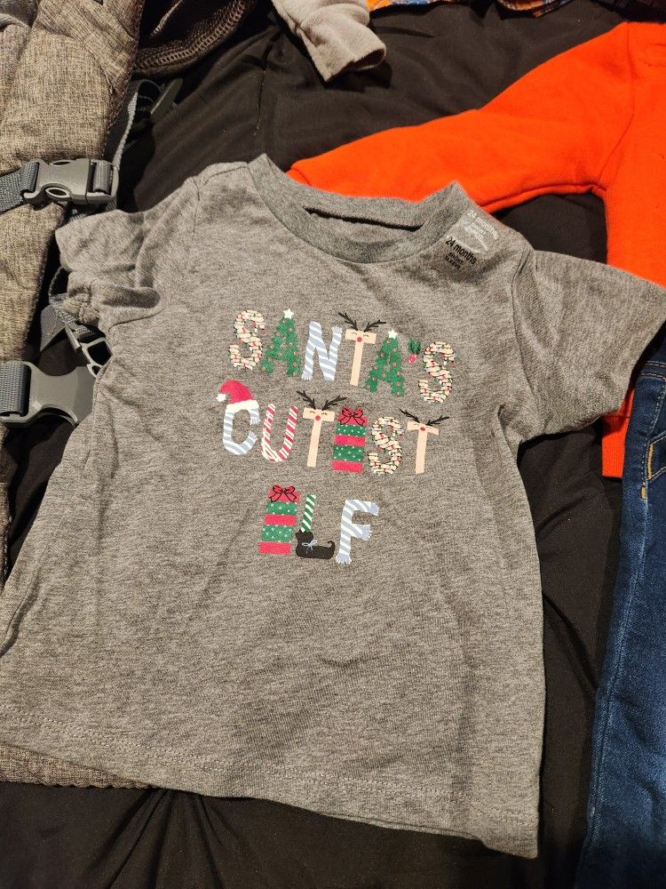 Baby Clothes, Carrier, Cover for Car Seat, Brand new Boots. Everything In Good Condition