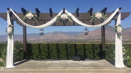 Silk Flowers And Off White Drape Shown As Example On This Pergola . Pergola Is Not For Sale. Also 18 Matching Table Centerpieces
