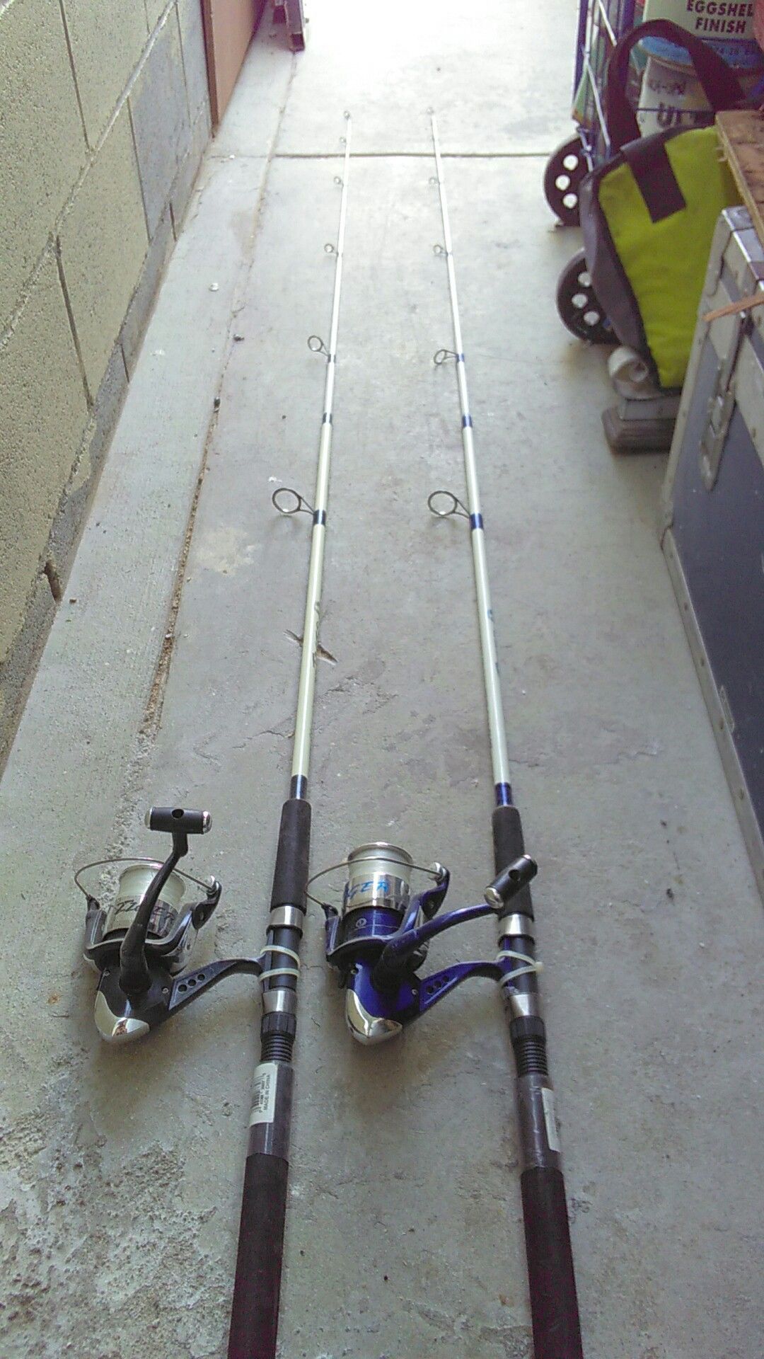 2 Tiger paw fishing rod and box of accessories