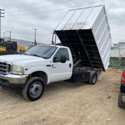 Dump Truck And Bobcat Work