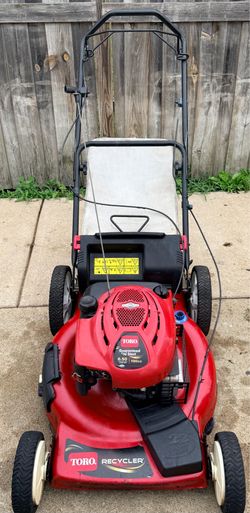 Toro 6.50 lawn mower, runs well; cash only.