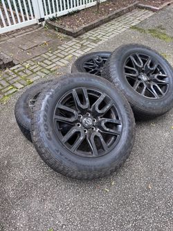 Chevy Black Alloy Wheels with Goodyear Trailrunner AT Tires