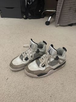 Jordan 4s black and white shoes