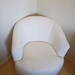 Light tan swivel chair