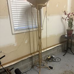 Tall Gold Torchiere Floor Lamp  Beautiful and very heavy metal floor lamp in excellent condition. 70” tall with a gold finish and bowl top design.