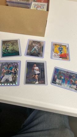 Trevor Lawrence jaguars football cards and a Travis ettine