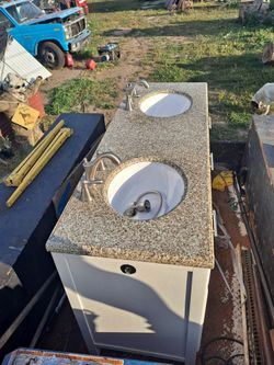 Granite Topped Double Sink Cabinet