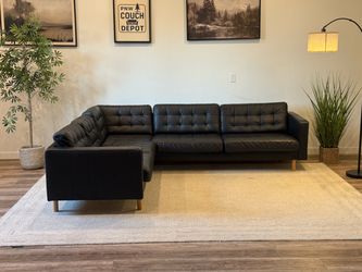 Black leather sectional couch delivery available