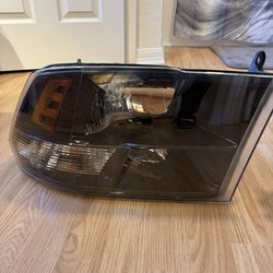 2015-2018 Ram 1500 Driver side Headlight lens housing.