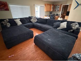 Large family room couch and ottomans