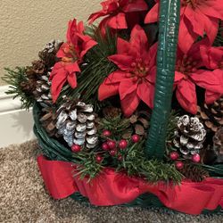 Poinsettias, Pine Cones And Greenery Lighted Christmas Decoration In A Green Basket