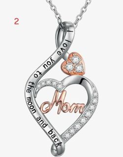 Mom silver and rose gold heart necklace with 'I love you to the moon and back' inscription. New, never taken out of box. $35 obo