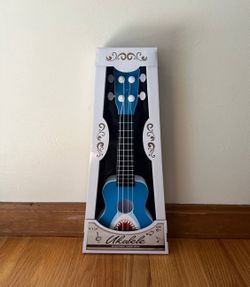 UKULELE WITH ADJUSTABLE TUNING PEGS 6" X 16"