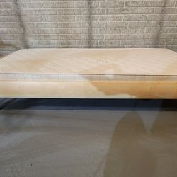 Twin bed with adjustable slatted frame