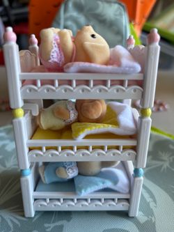 Toy  poodle baby figures in cribs