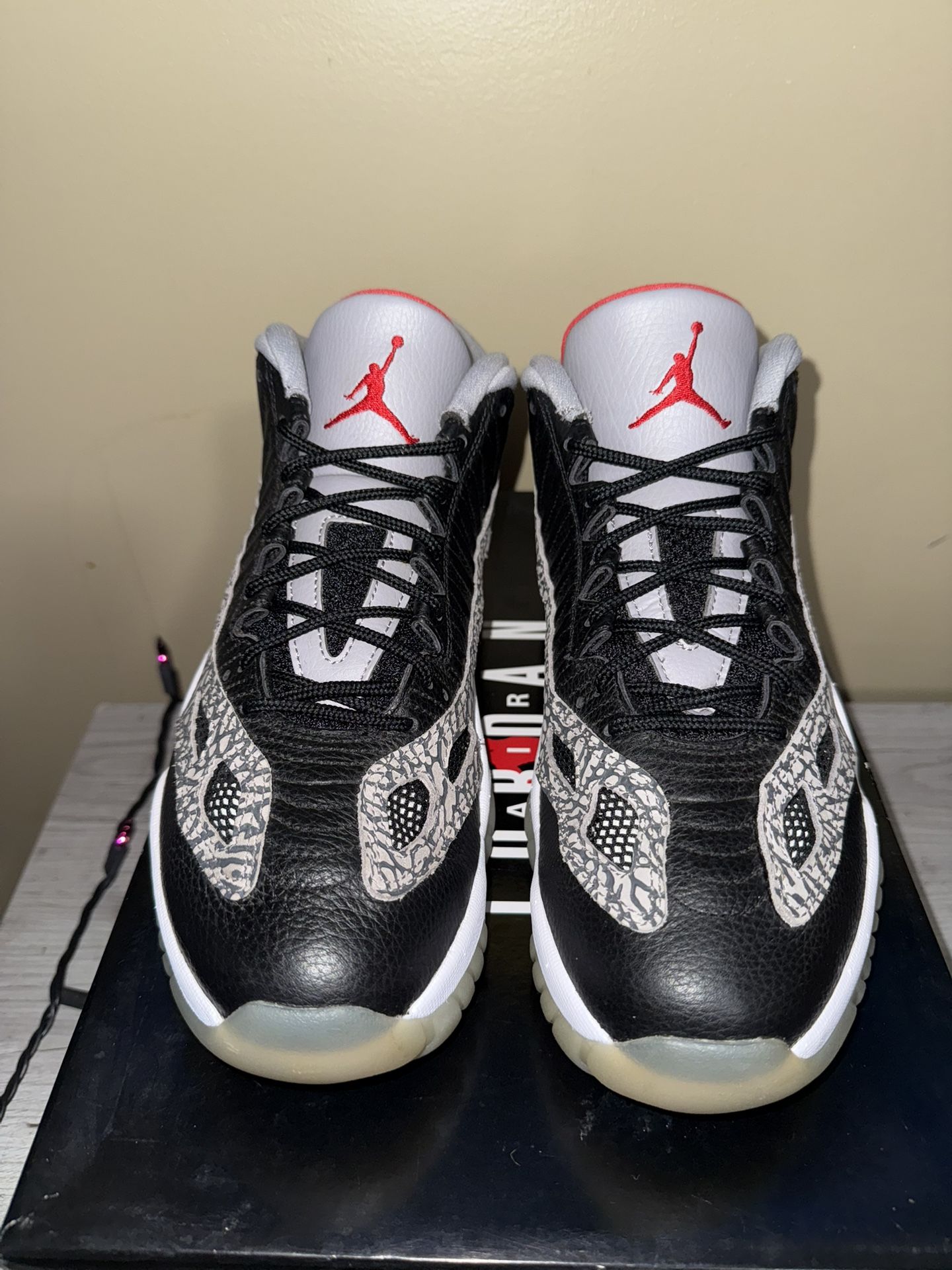 Jordan 11 Low “Black Cement IE”