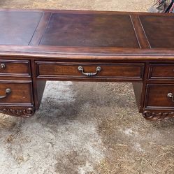 Vintage Chippendale style executive desk with leather top and claw feet