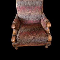 Paul Roberts traditional style arm chair  on dark wood frame with patterned upholstered cushions. 33"wide x 38"deep x 40"high. 