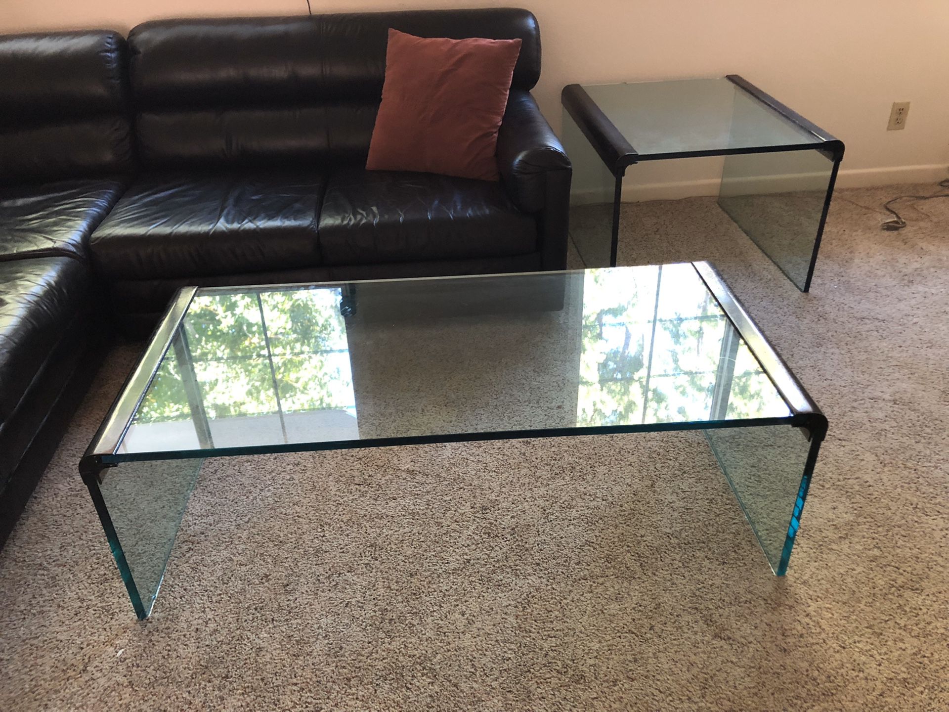 Two heavy glass coffee tables