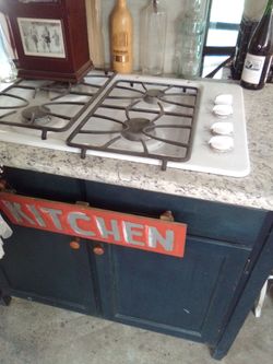 General Electric gas stove top with wood cainets