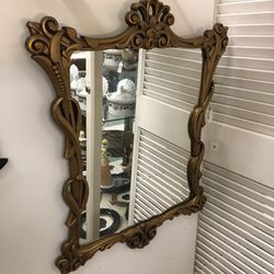 MIRROR DATED 1971 GOLD COLORED