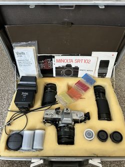 MINOLTA SRT 102 35mm Camera plus extras