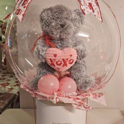 Stuffed animals inside balloons