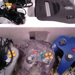 Nintendo 64 Console w/ 3 Controllers @ Cables Tested.  "RF Switch" and
"RFU Adapter" included.  