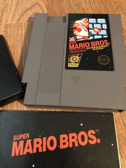 5 screw Super Mario Bros. with manual and dust cover. Nintendo video game.