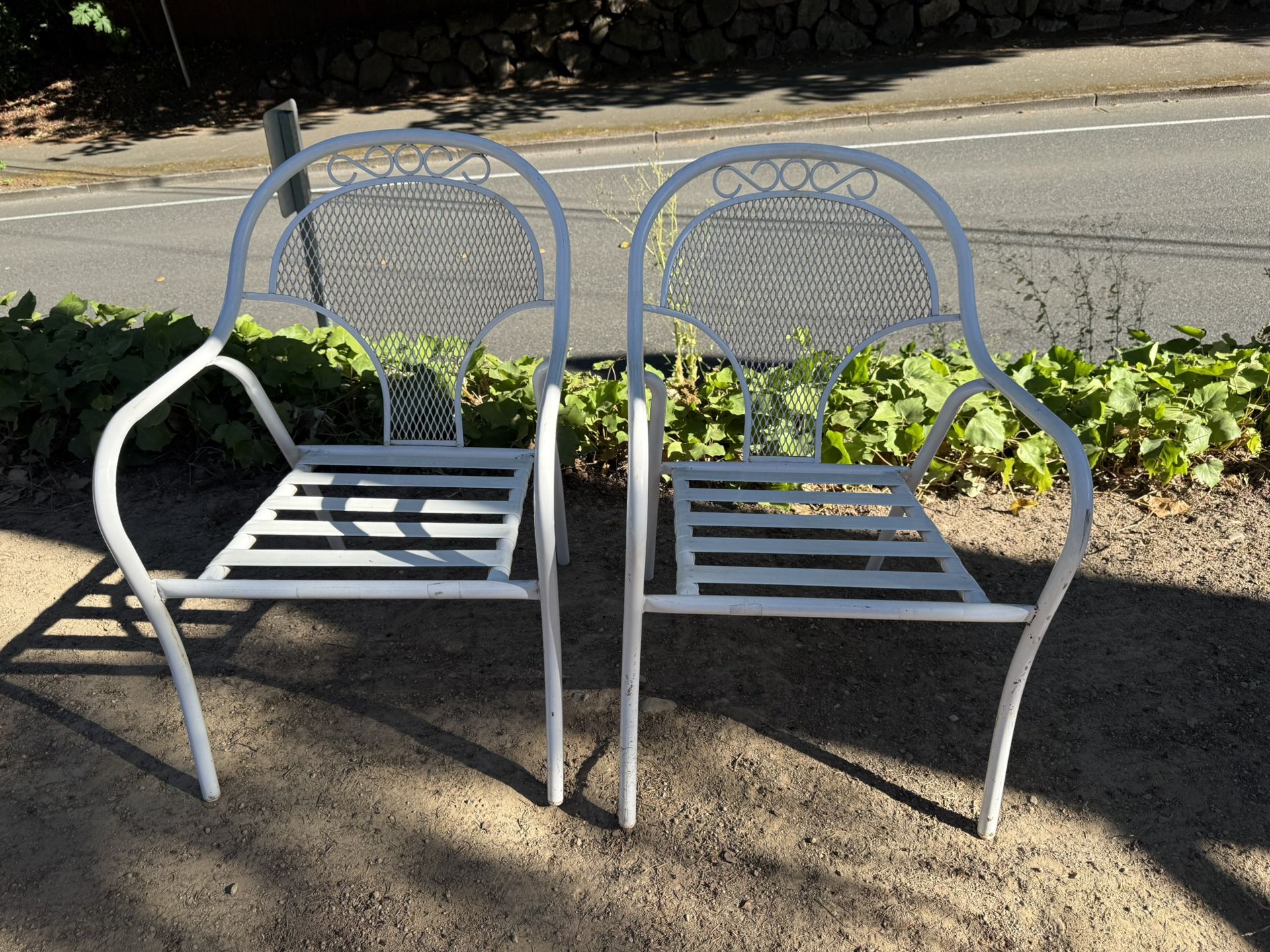 Vintage Stacking Wrought iron white chairs set up two