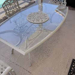 Oval glass top table with 2 swivel chairs, 1 standard chair and umbrella base (no umbrella)