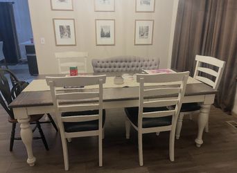 Table With Four White Chairs