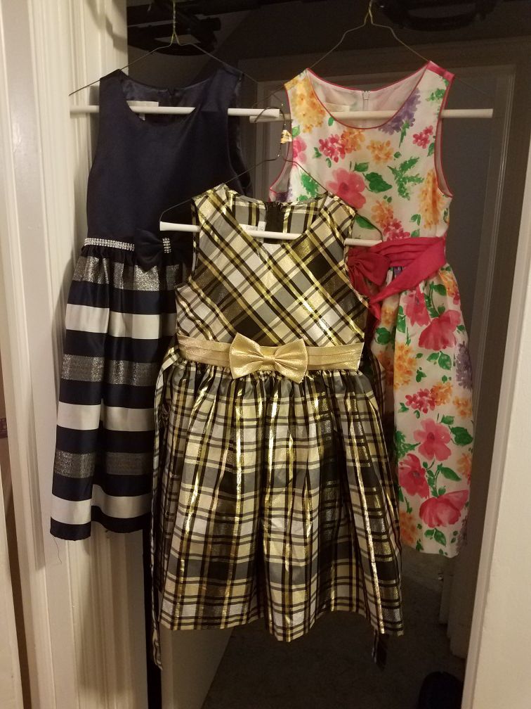 Girl's Dresses; Size 12; Navy, blue, silver, and white; black, gold, & white; white w/ flowers - $25 ALL