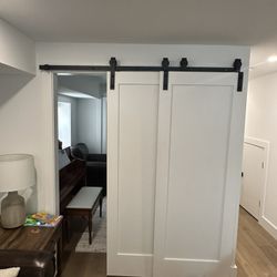 Wood barn doors w/ black hardware 