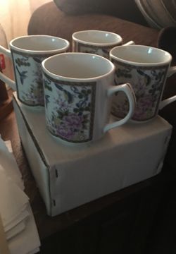 Set of 4 Homco coffee mugs. Still in box 10 dollars or OBO