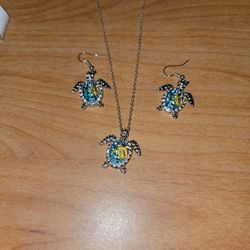 21 Inch Turtle Necklace  With Matching Earrings White And Blue Topaz Stones