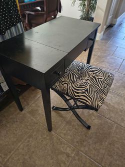 Vanity table with zebra print chair