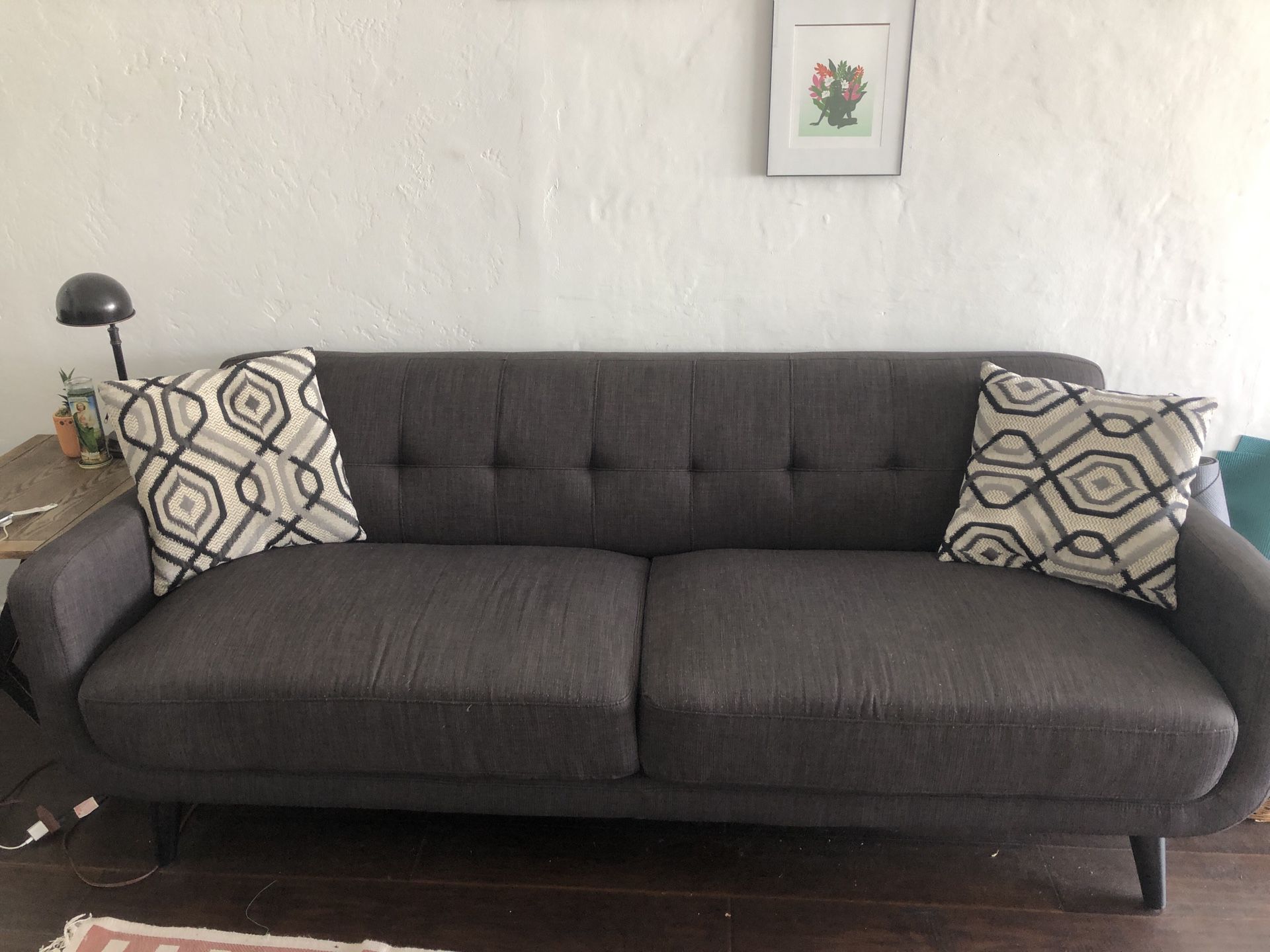 Grey couch with pillows