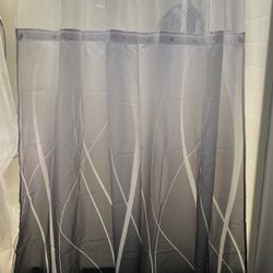 grey and white ombre-style shower curtain with a sheer mesh panel top