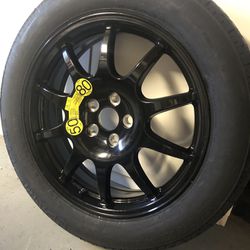 20” black Range Rover rim with spare tire