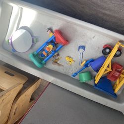 Kids sand box with sand and toys