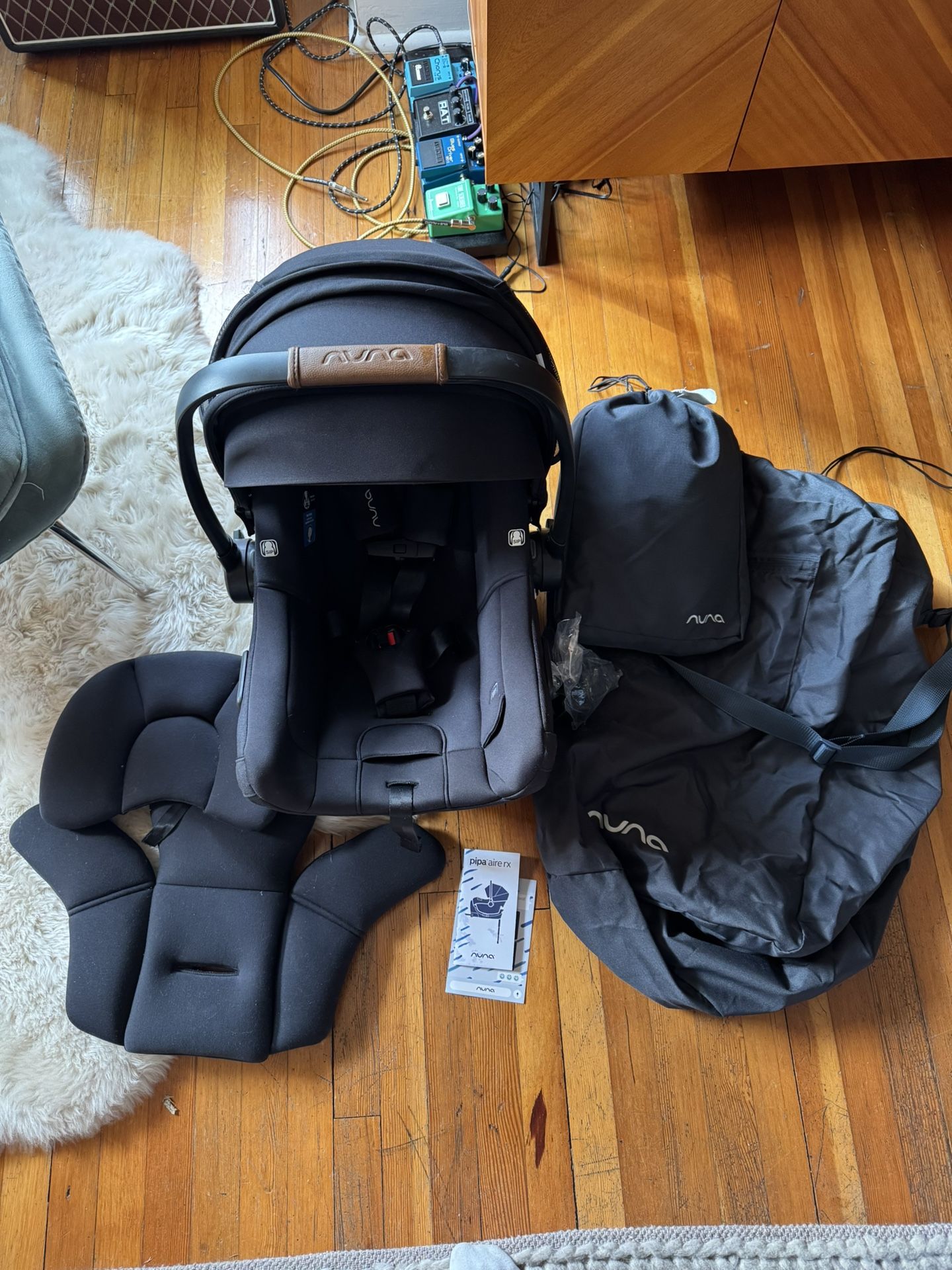 Nuna Pipa AIRE RX Car Seat, Accessories, And RLX Base In Caviar