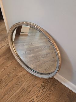 Gold oval mirror