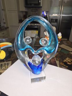 Glass face sculpture.