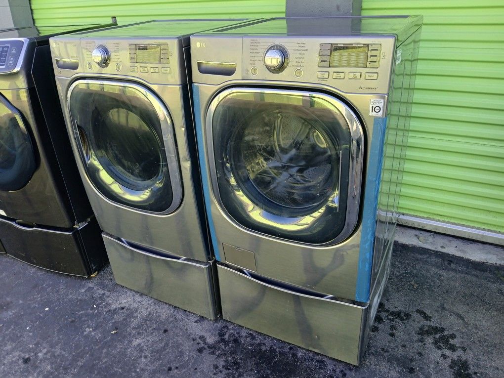LG GRAY STEAM JUMBO FRONT LOAD WASHER AND GAS DRYER SET WITH PEDESTAL INCLUDED